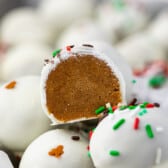 gingerbread truffles covered in white chocolate and green and red sprinkles