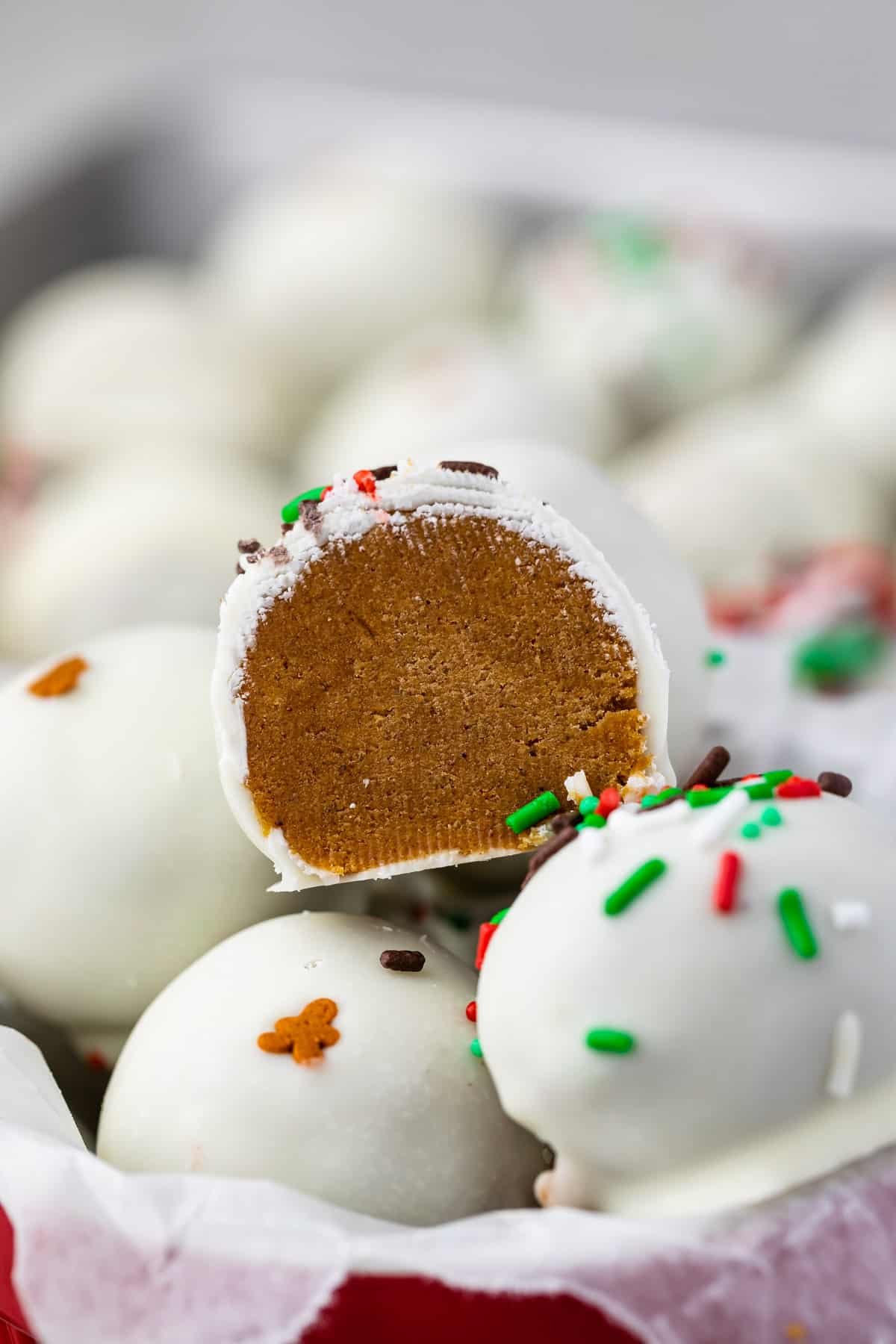 gingerbread truffles covered in white chocolate and green and red sprinkles