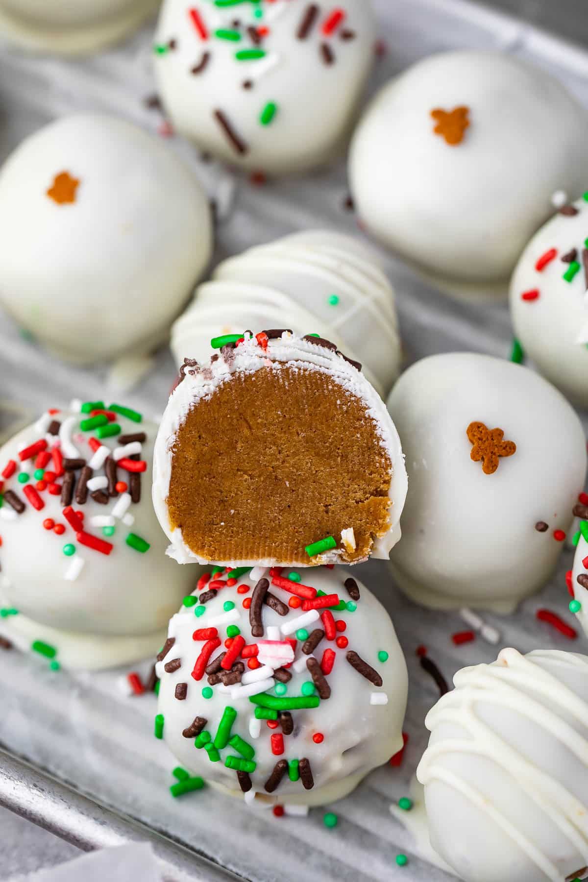 gingerbread truffles covered in white chocolate and green and red sprinkles
