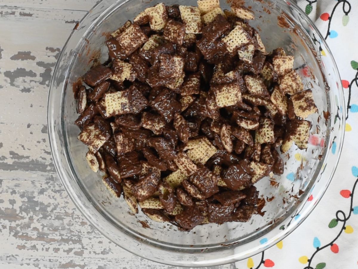 bowl of Chex cereal coated in chocolate.