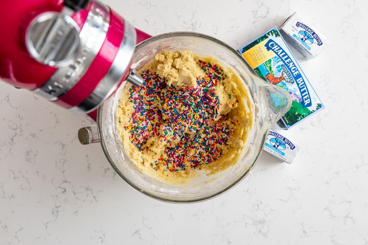 kitchen aid mixer with cookie dough and sprinkles with butter box