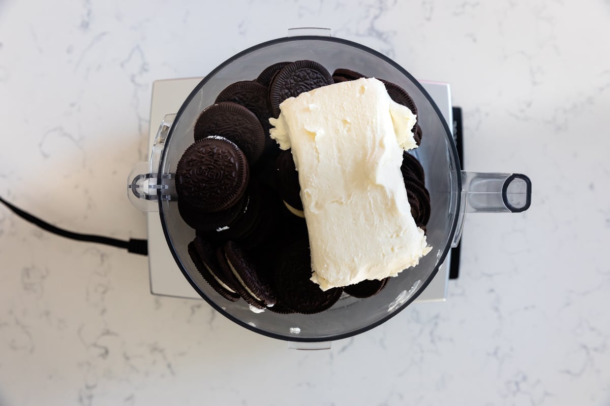 food processor with Oreos and cream cheese.