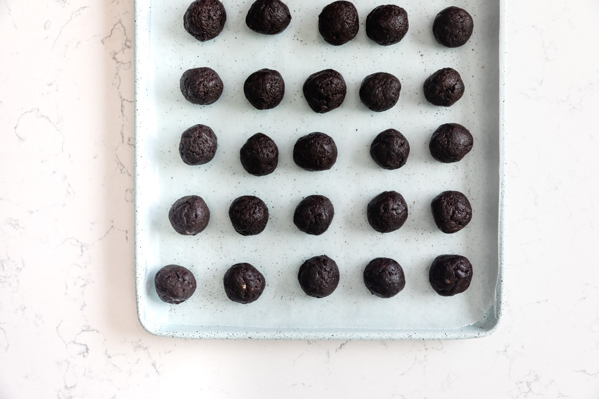 Oreo balls on cookie sheet.
