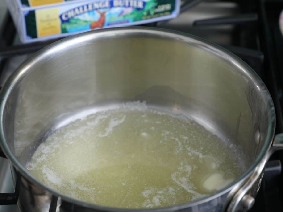 pot on stove with melted butter.