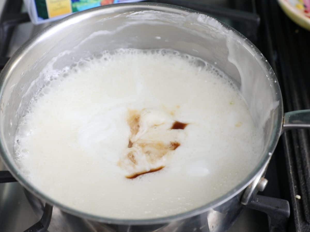 pot on stove with melted marshmallow mixture and vanilla.