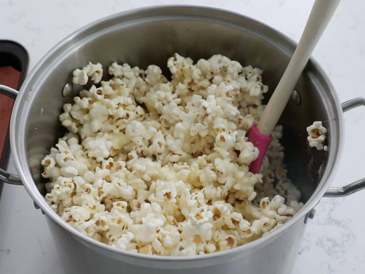 pot on counter with popcorn and marshmallow mixture.