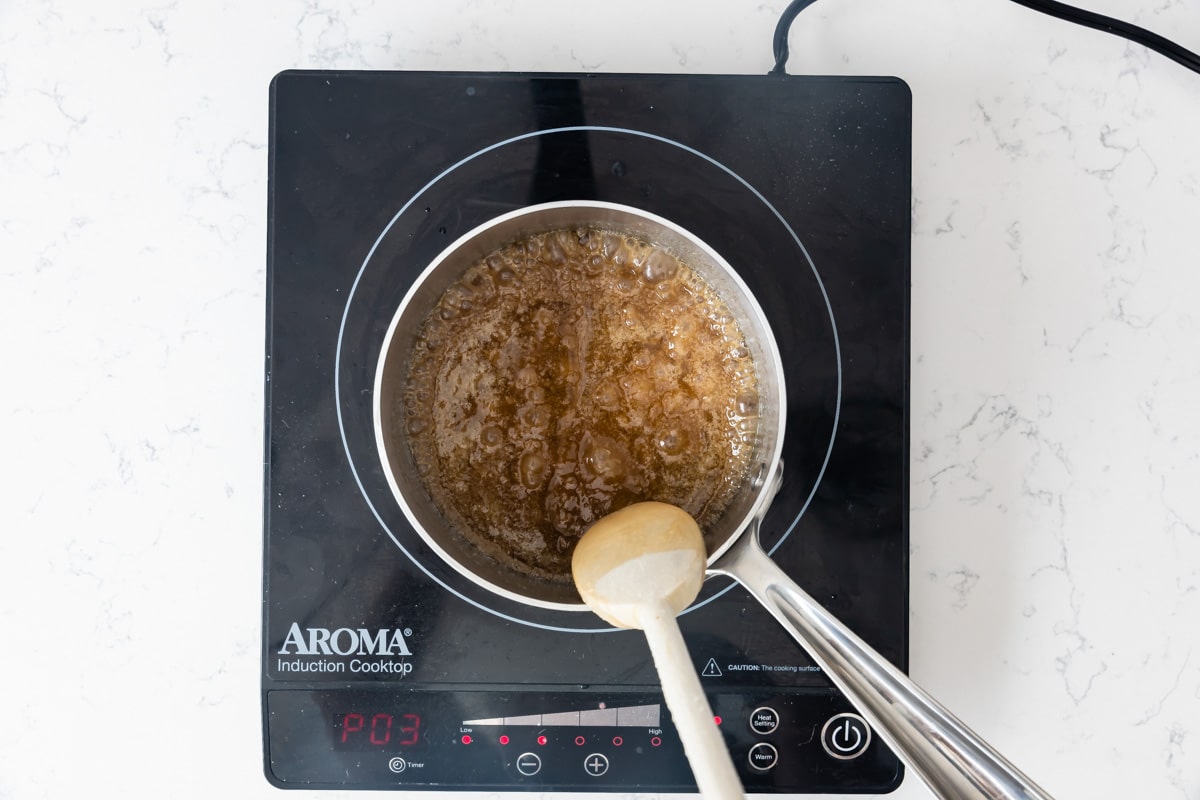 pan on hot plate with boiling brown sugar