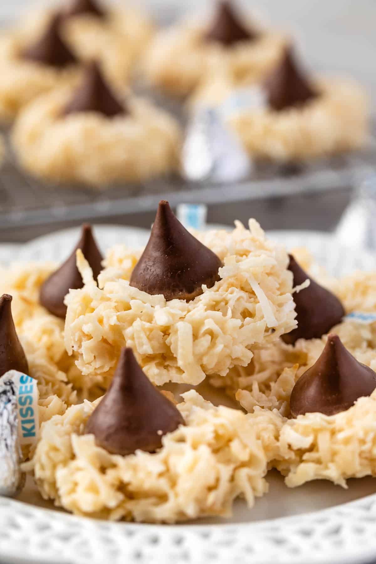 macaroon blossoms stacked on a white plate