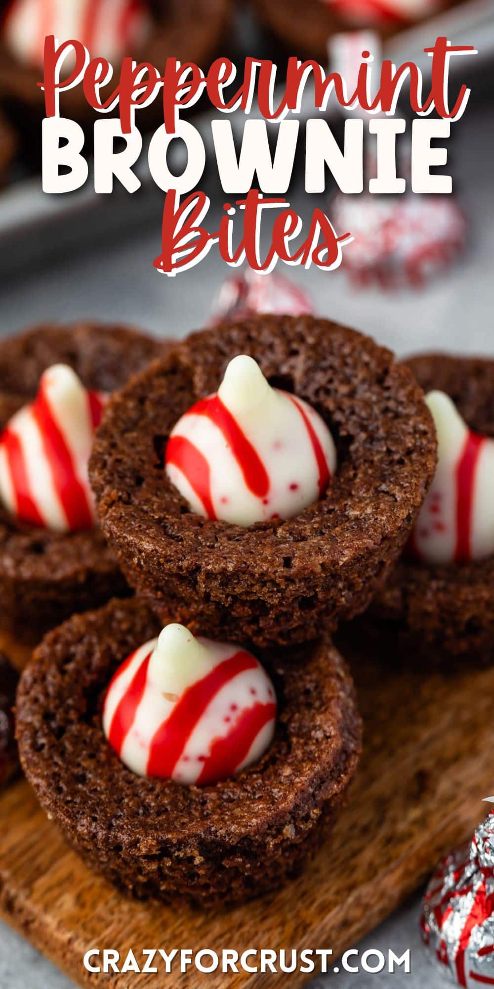 stacked brownie bites with a peppermint kiss in the middle with words on top
