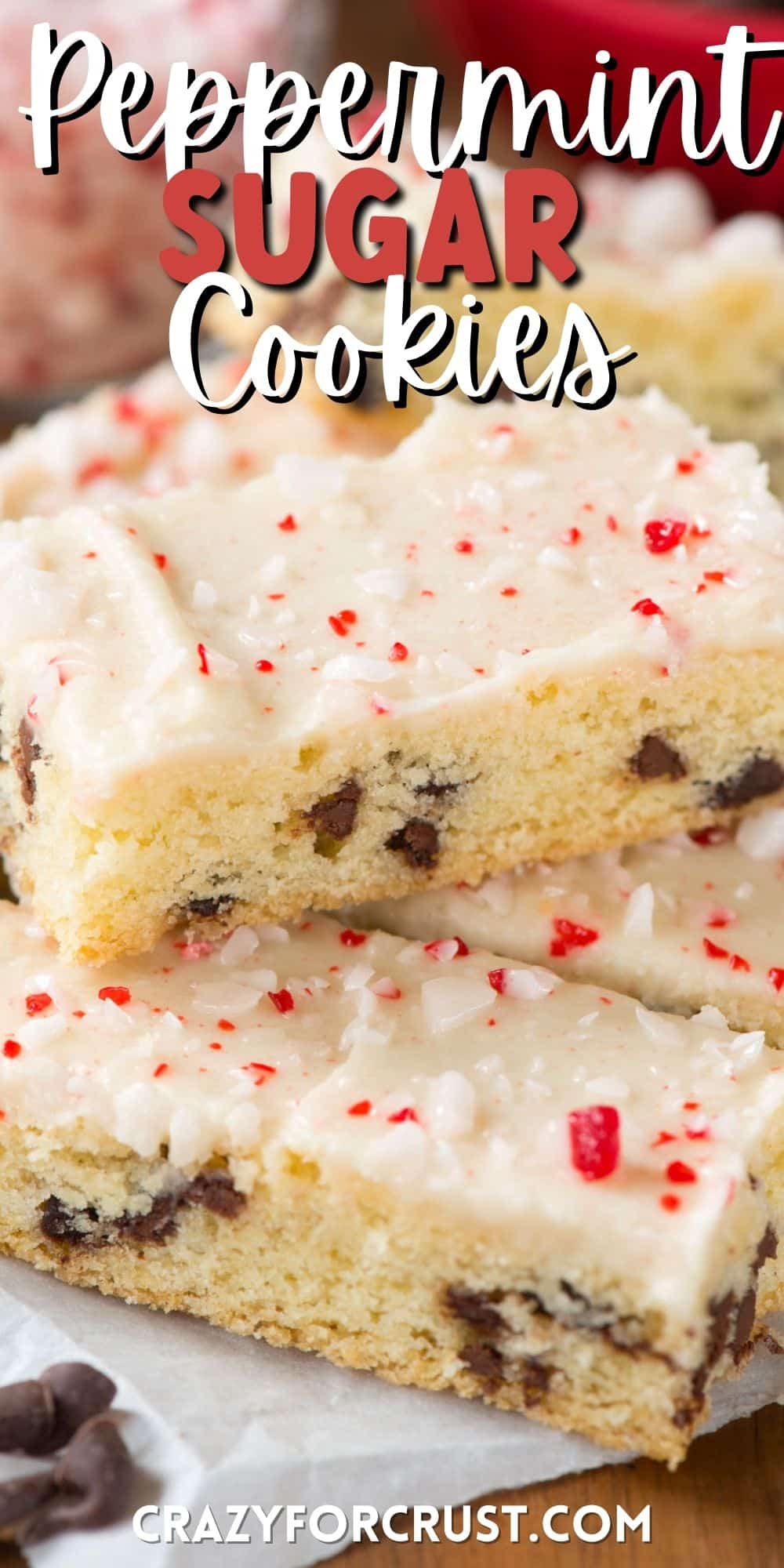 chocolate chip cookie sticks with white icing and crushed peppermint on top with words on top