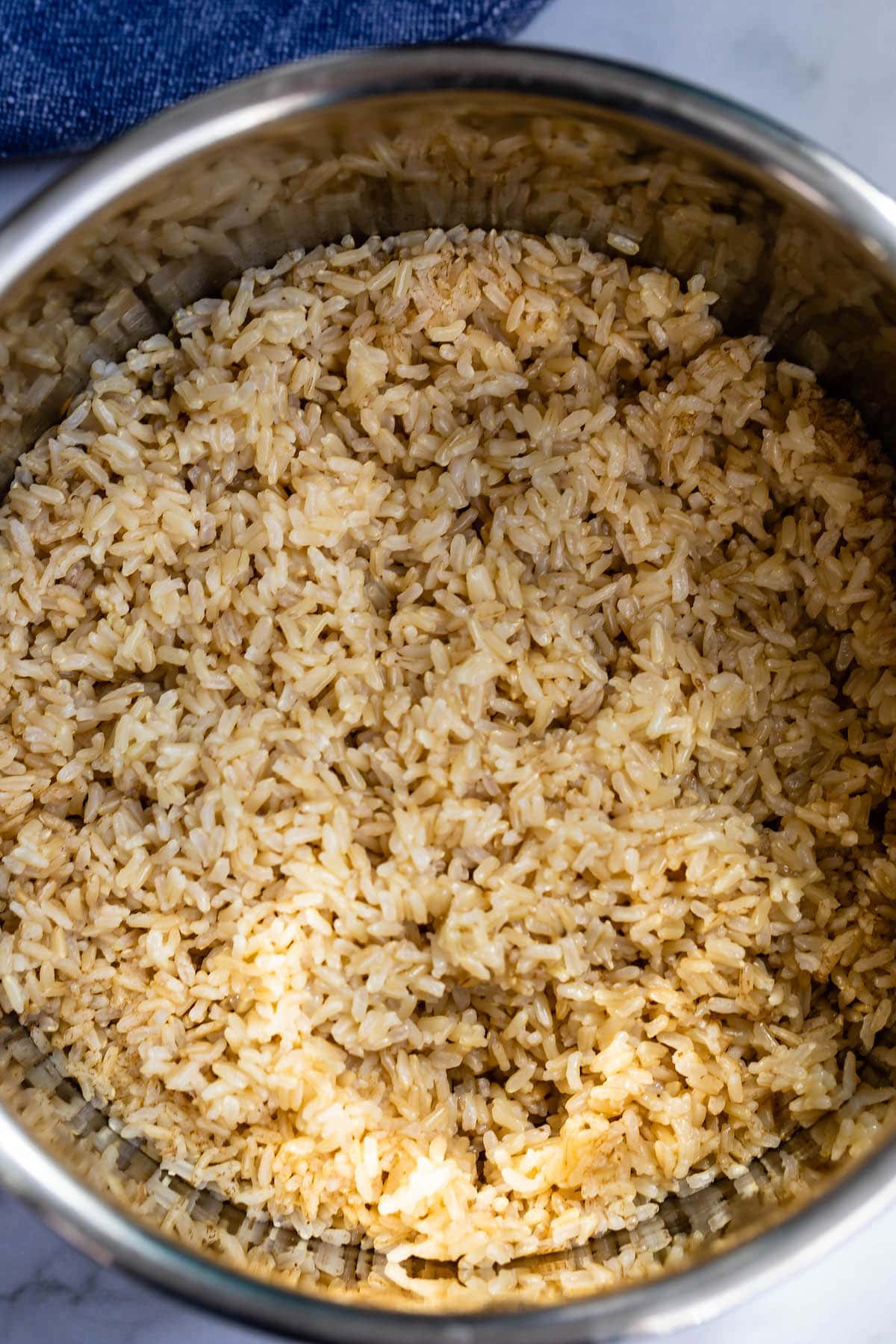 brown rice in a metal bowl