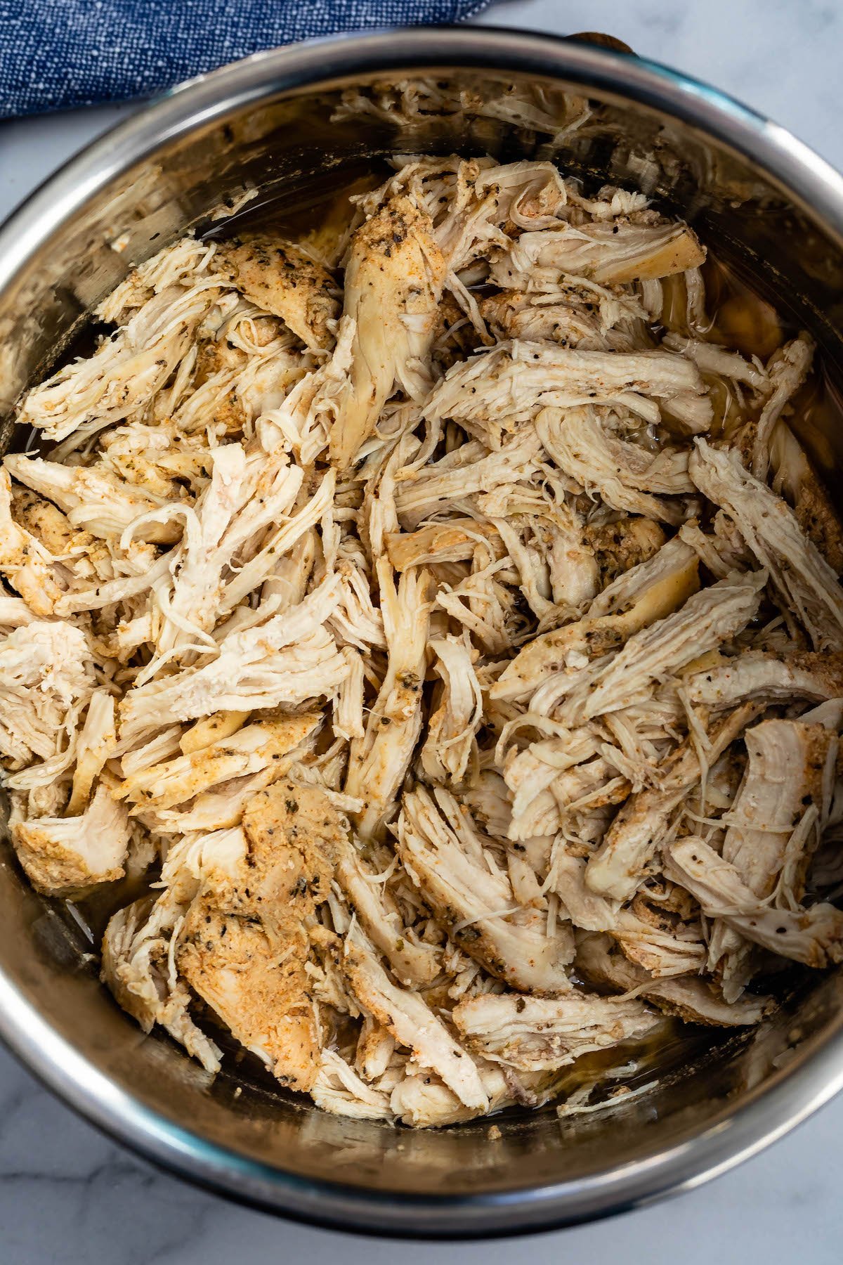 shredded chicken in a pan