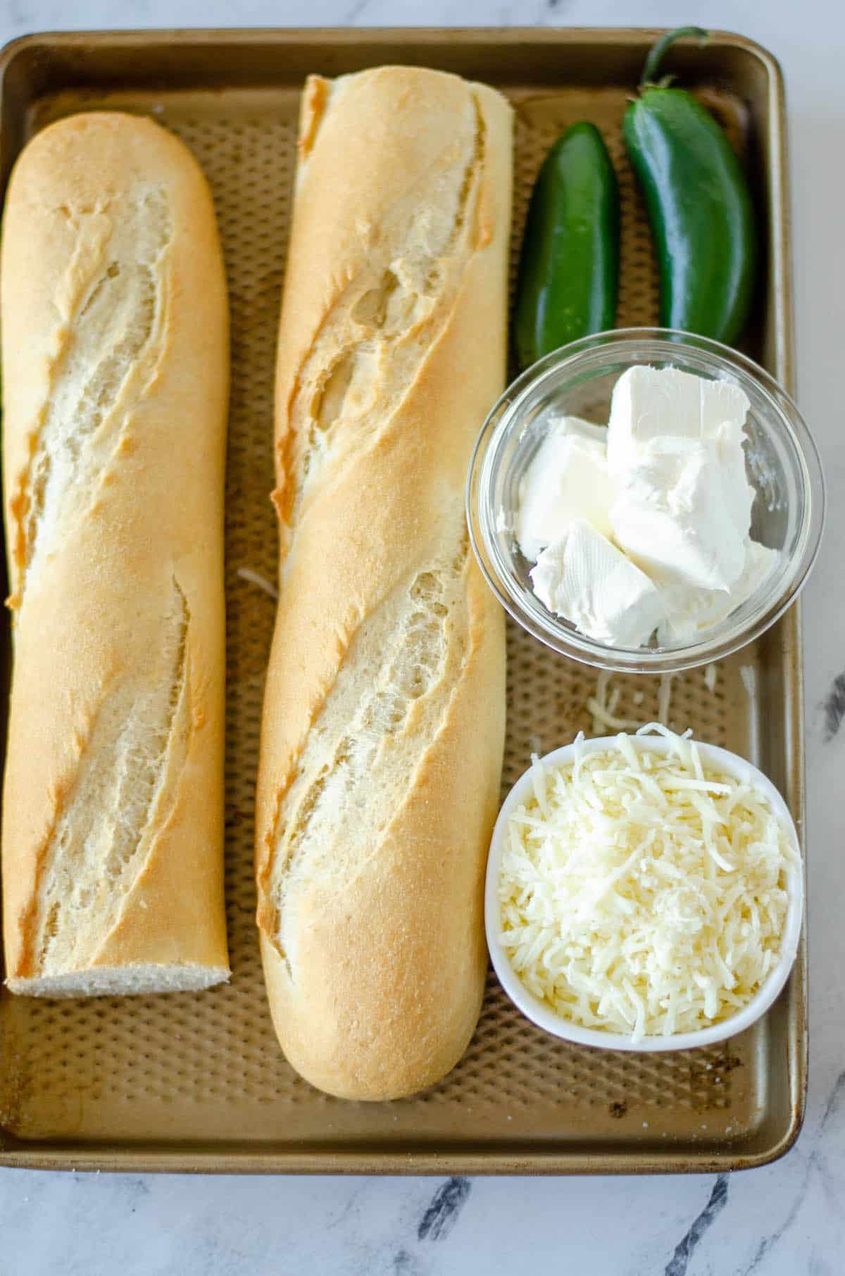 ingredients in the jalapeno bread on a cooking sheet
