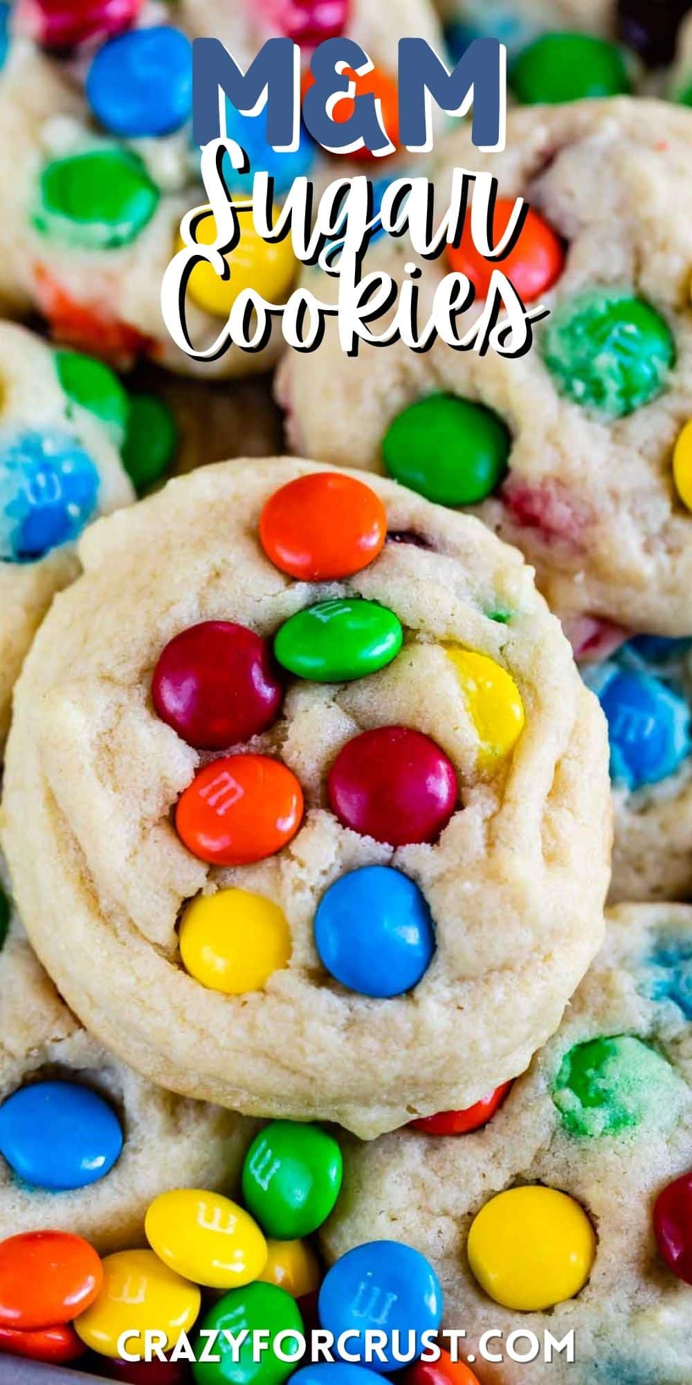 sugar cookie with colorful m&ms baked in with words on top of the image