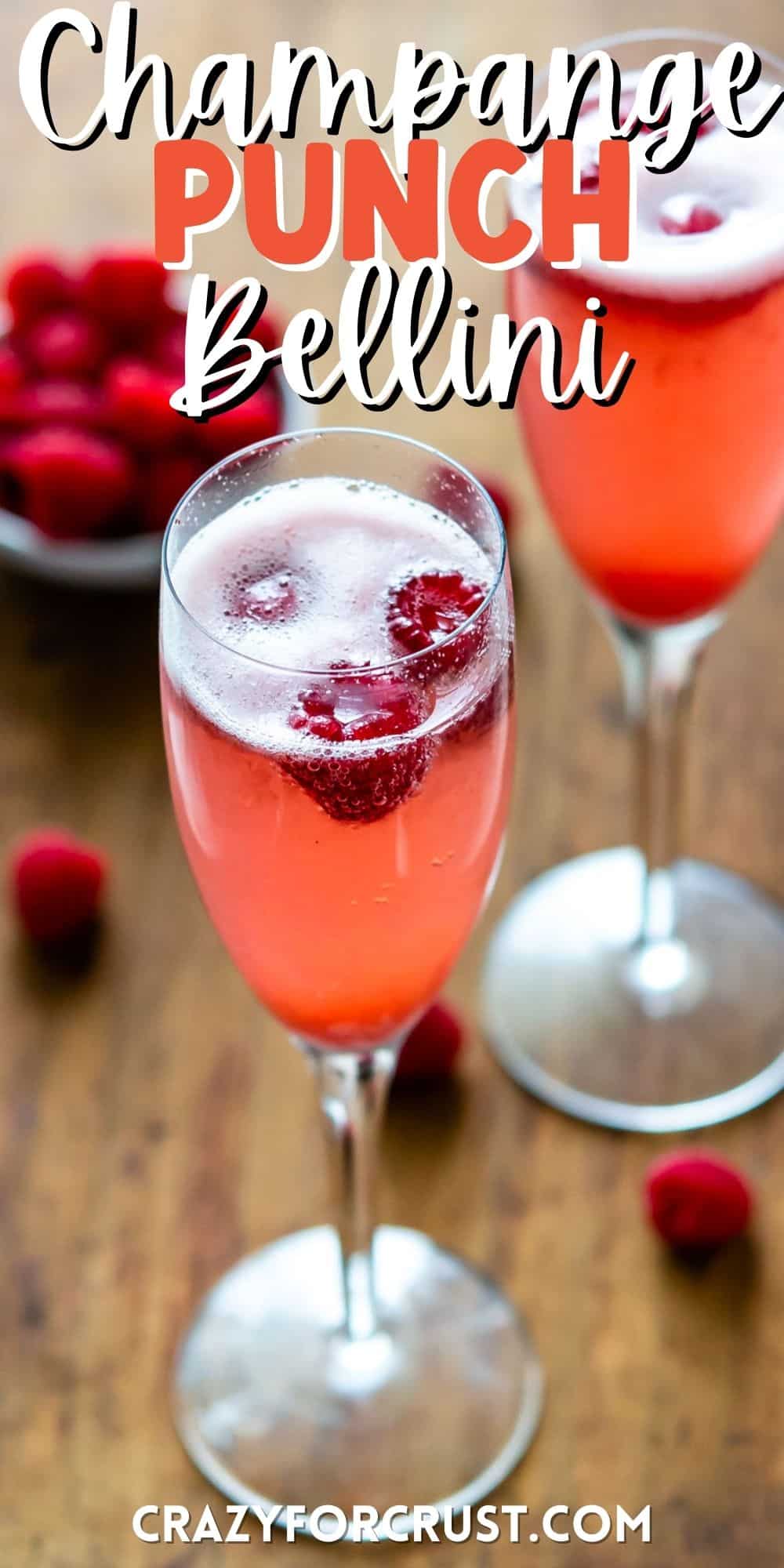 pink drink in a tall glass with raspberries around it with words on the image