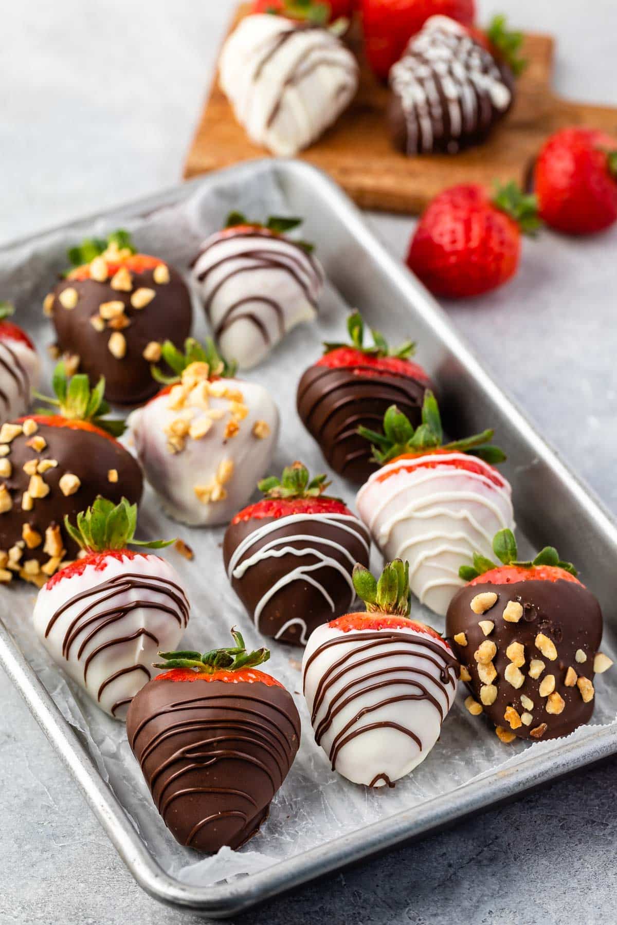 chocolate covered strawberries on a baking pan