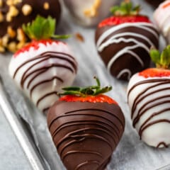 chocolate covered strawberries on a baking pan