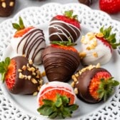 chocolate covered strawberries on a white plate