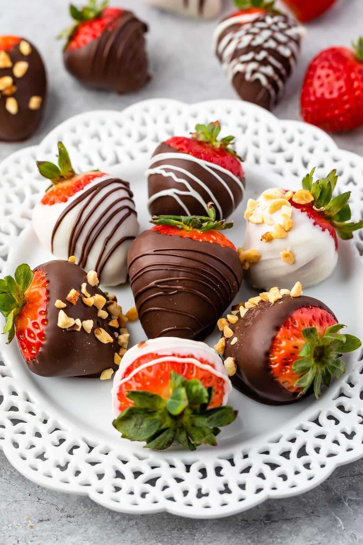 chocolate covered strawberries on a white plate