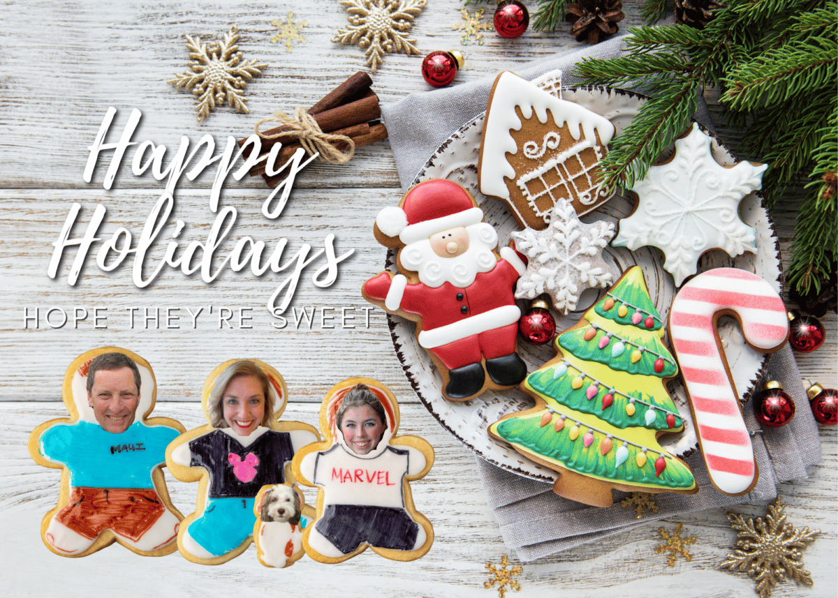 christmas card with sugar cookie people on a wood background