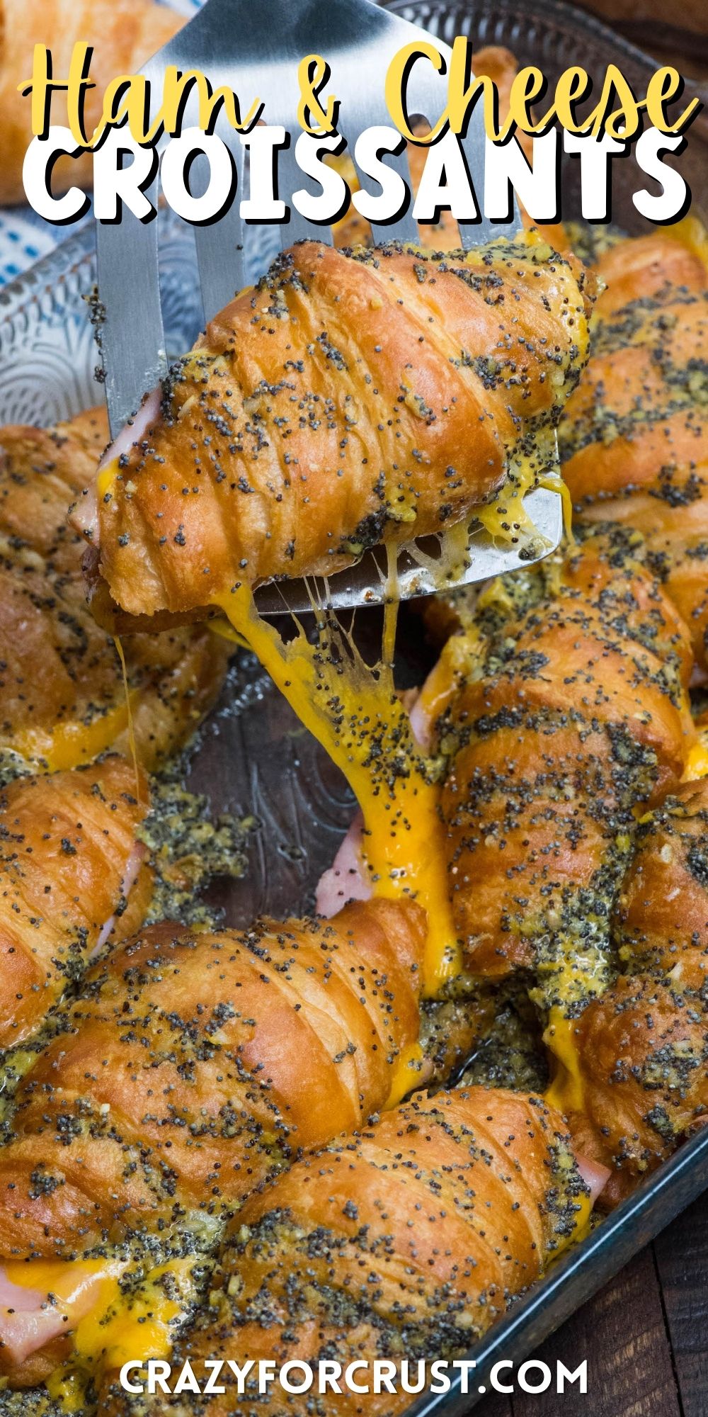 spatula holding a cooked croissant on it with words on top