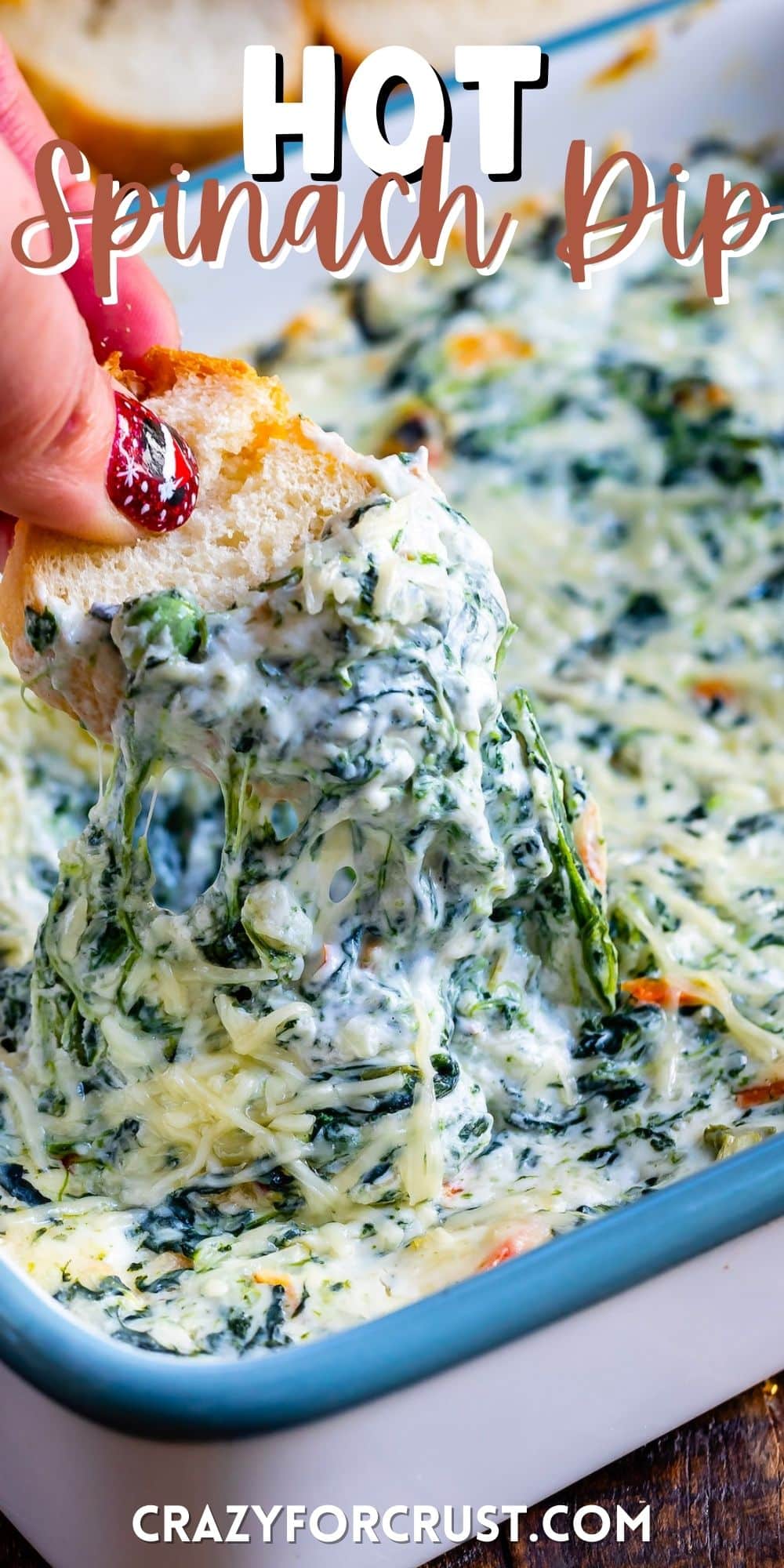 bread being dipped in the spinach dip by a hand with words on top