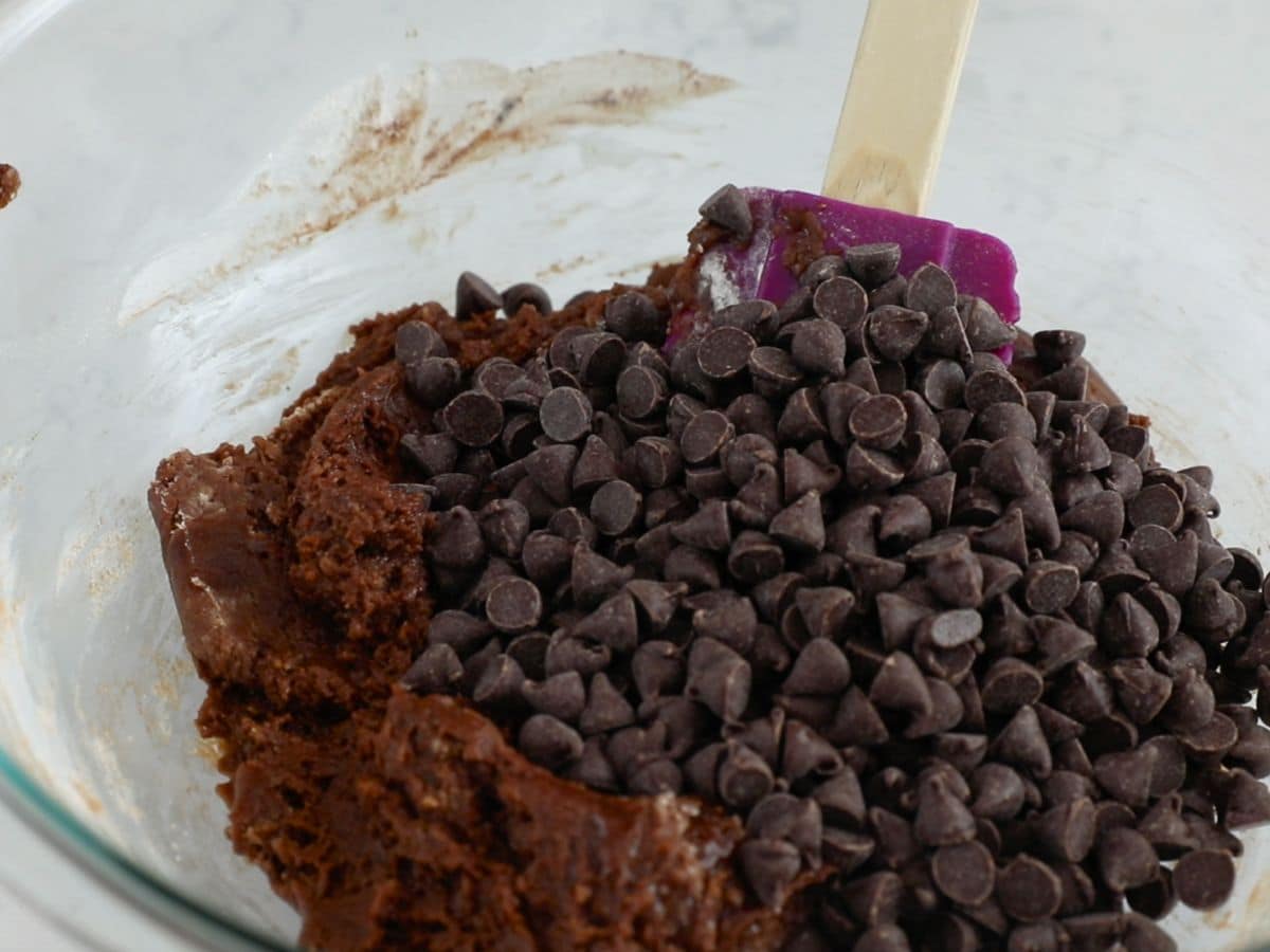 bowl of chocolate cookie dough with chocolate chips.