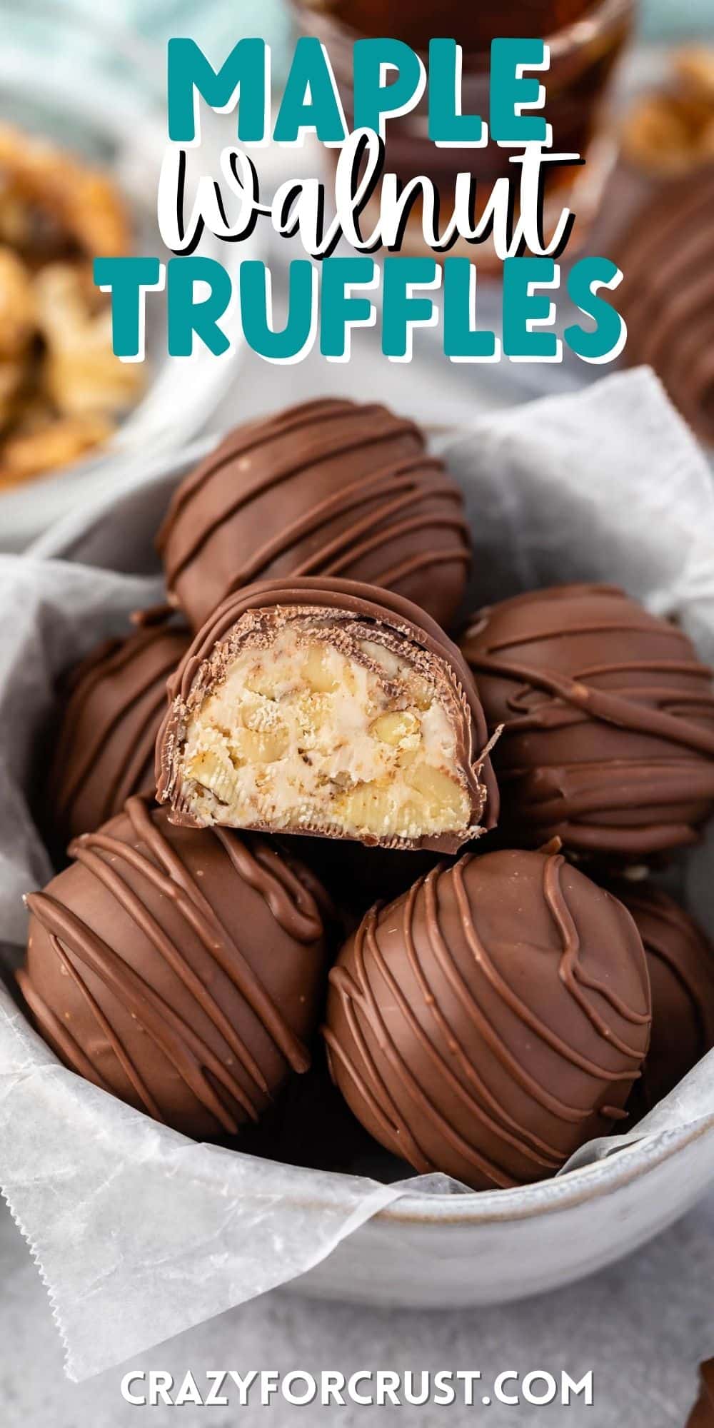 maple walnut truffles covered in chocolate in a white bowl with words on top