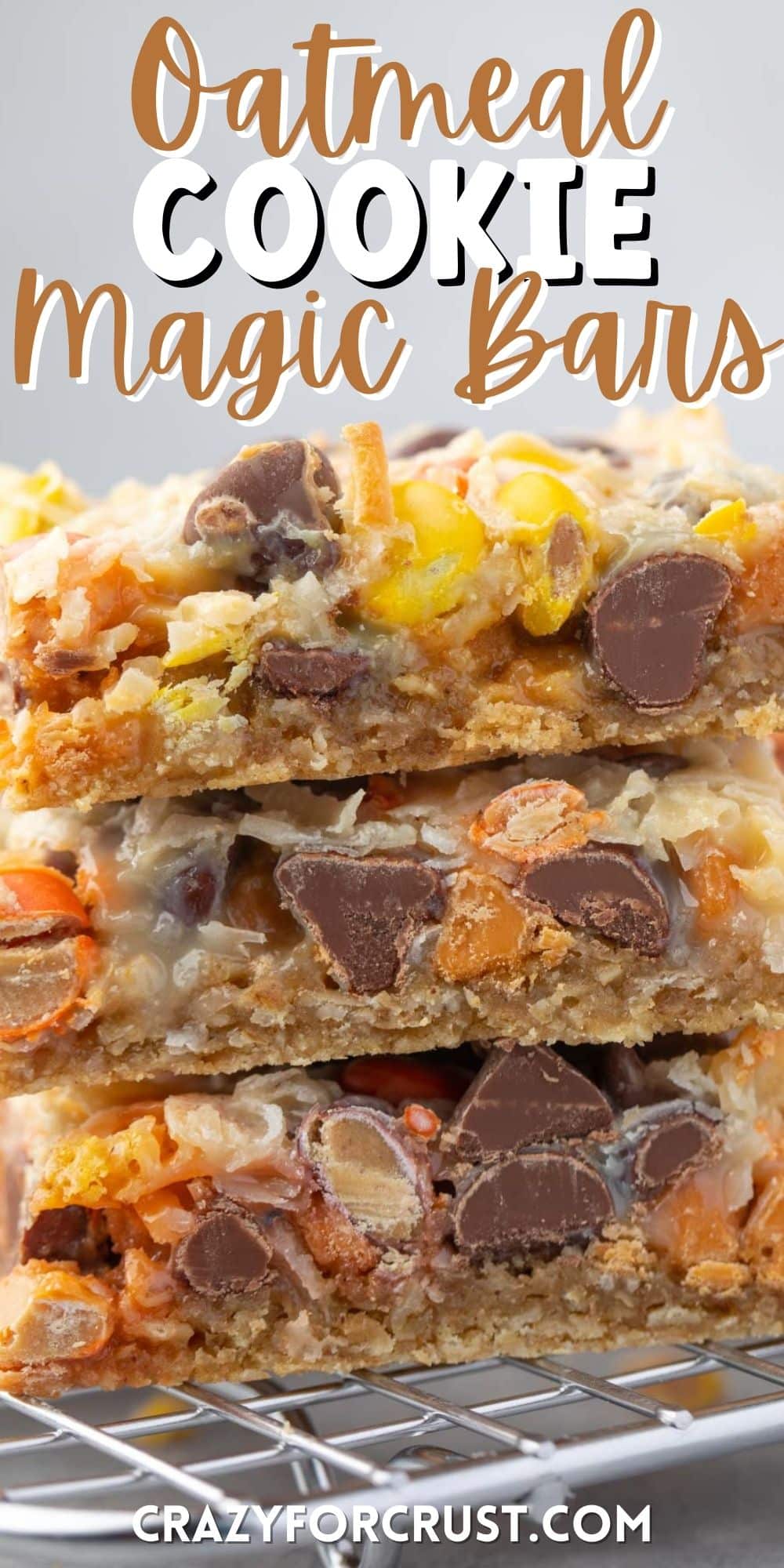 stacked bars with chocolate chips baked in on a drying rack with words on top