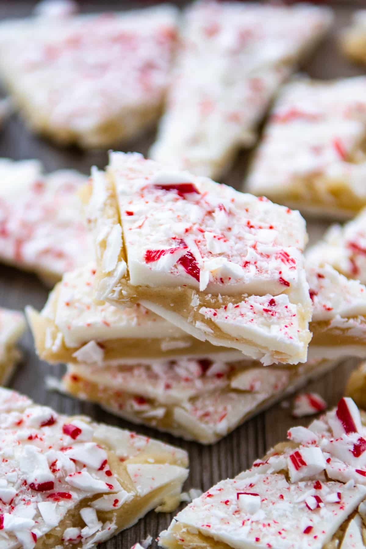 peppermint bark laid out on a brown wooden board