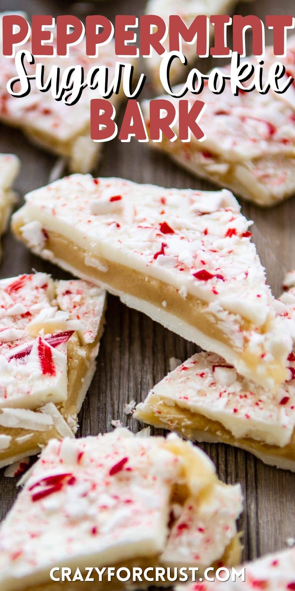 peppermint bark laid out on a brown wooden board with words on top