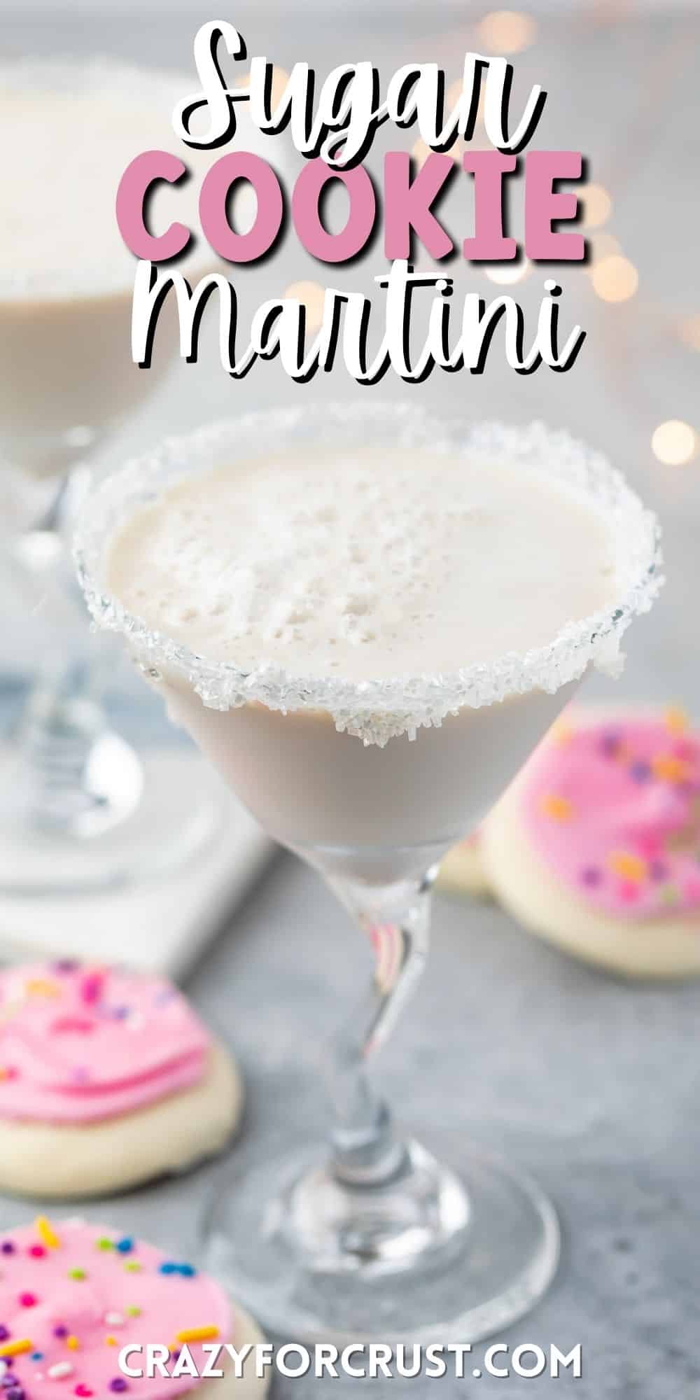 white drink in a a martini glass with sugar cookies around the base of the glass with words on top