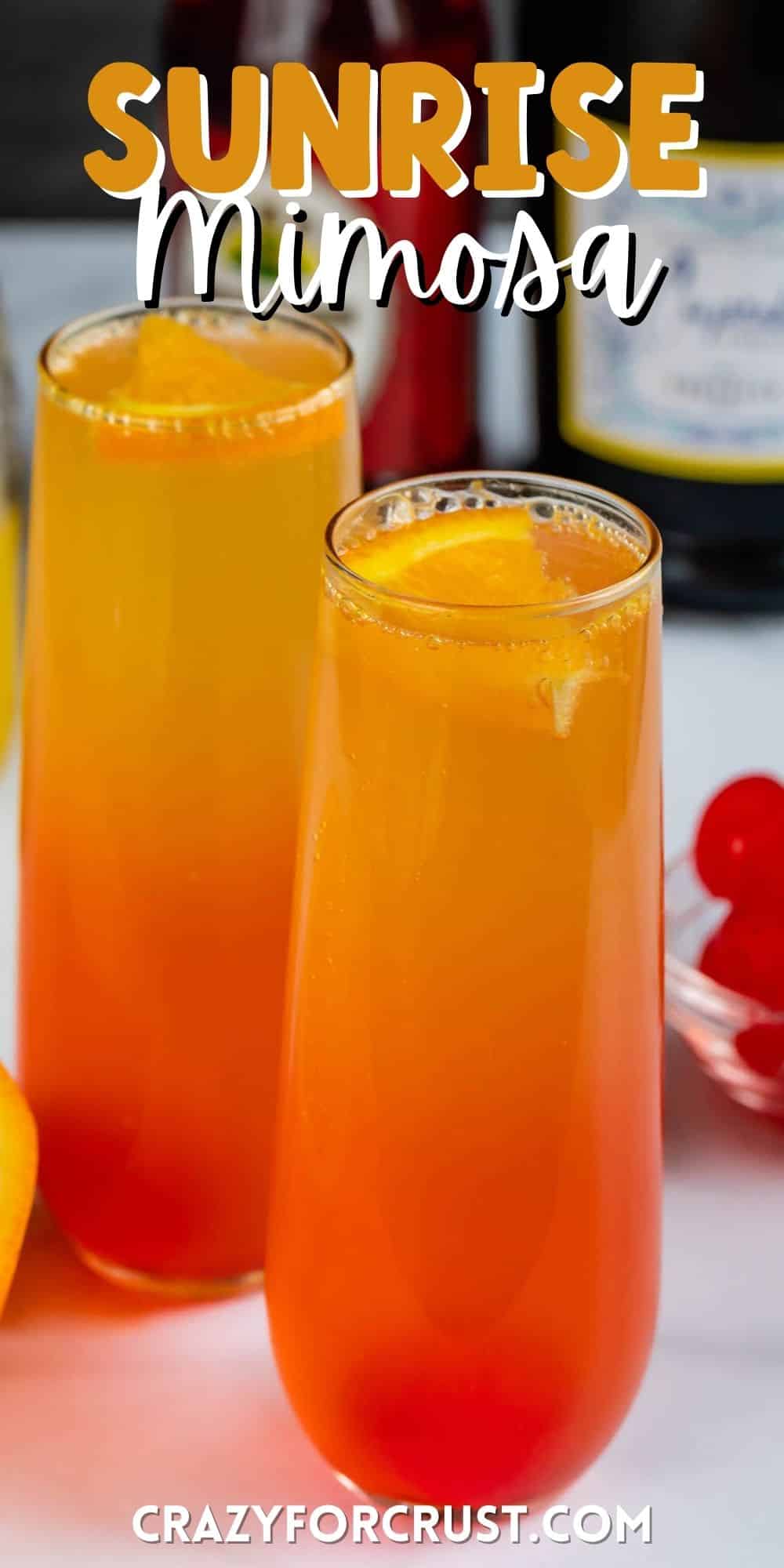 two glasses of orange and red ombre drink inside with words on the image