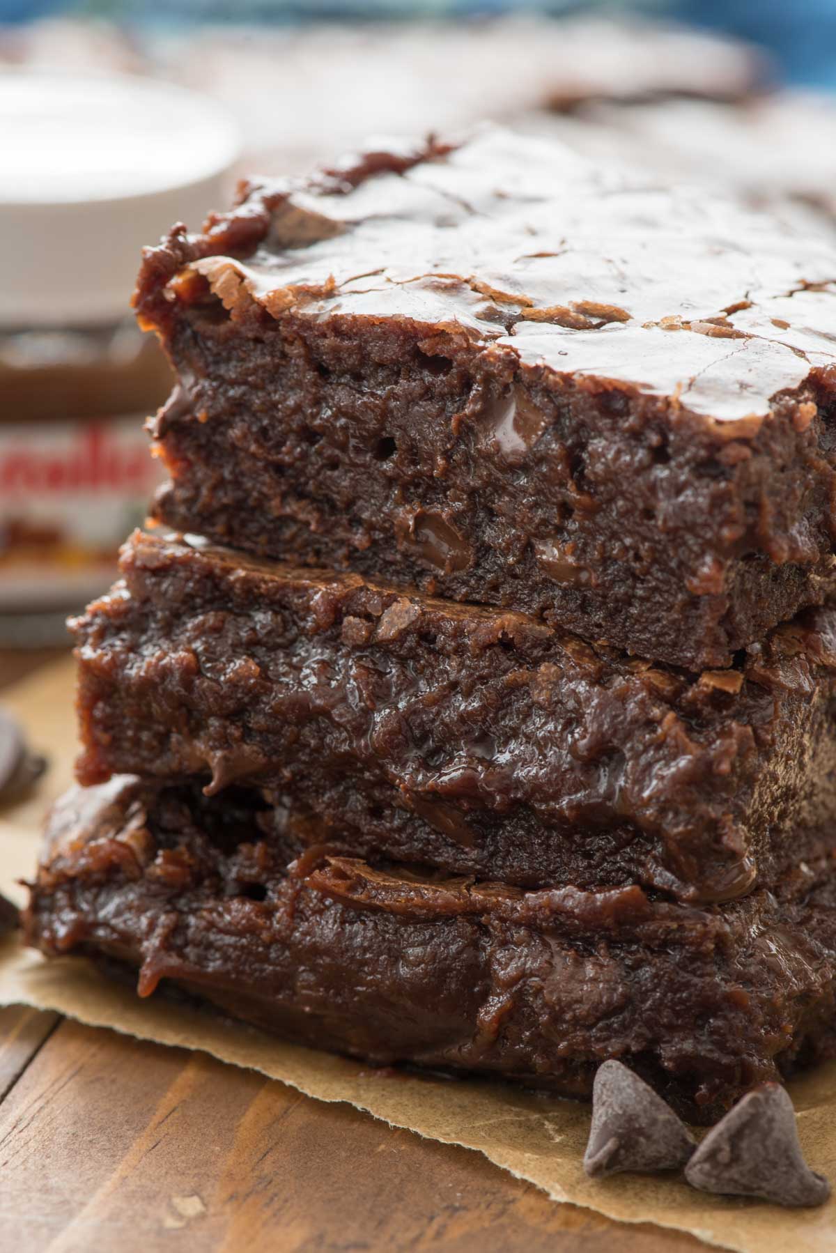 stacked brownies and a wood table