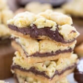 stacked crumble bars with nutella in the middle