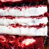 red velvet loaf covered in white frosting