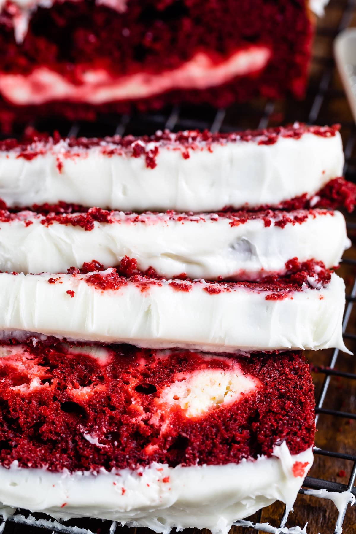 red velvet loaf covered in white frosting