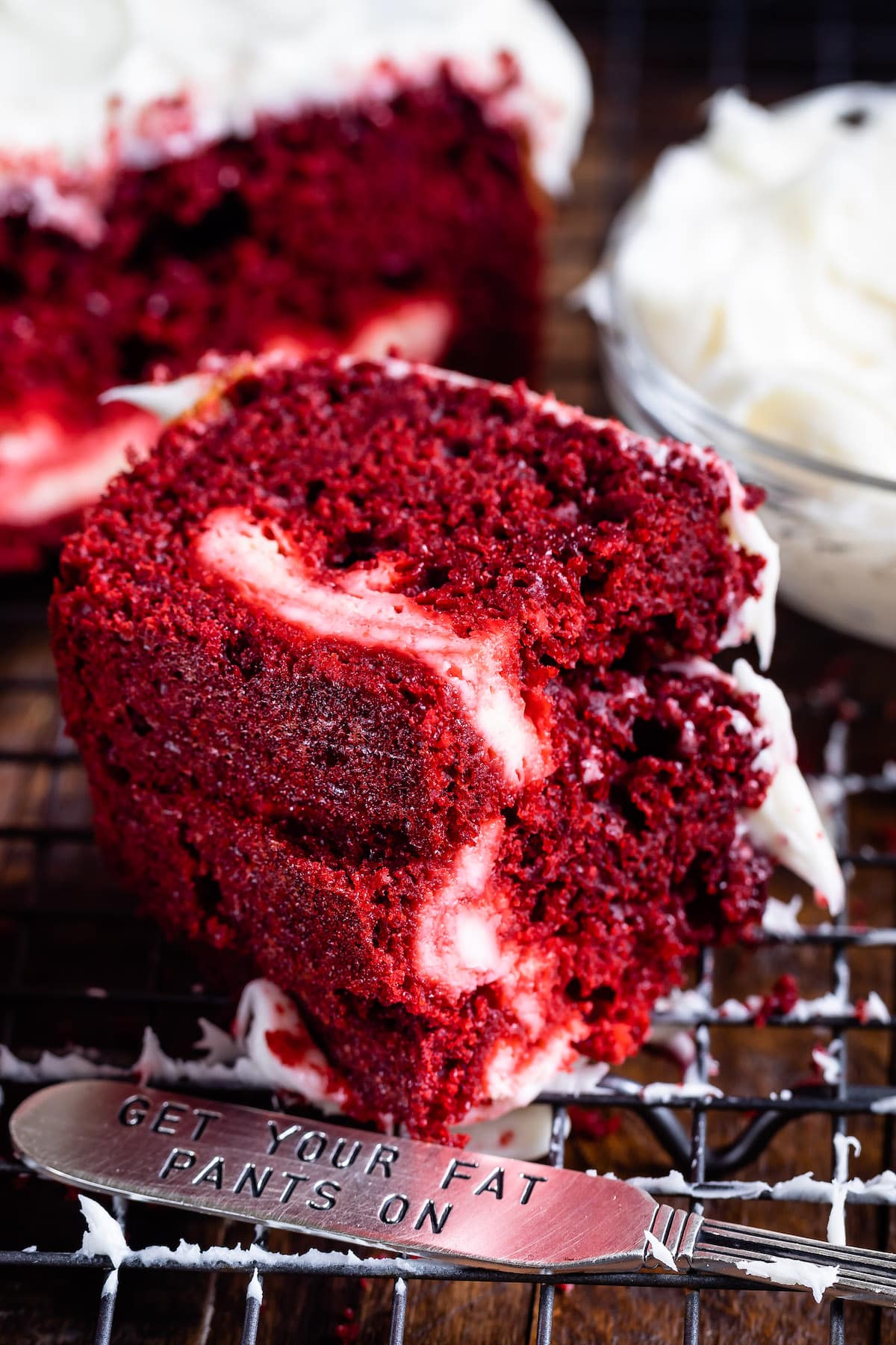 red velvet loaf covered in white frosting