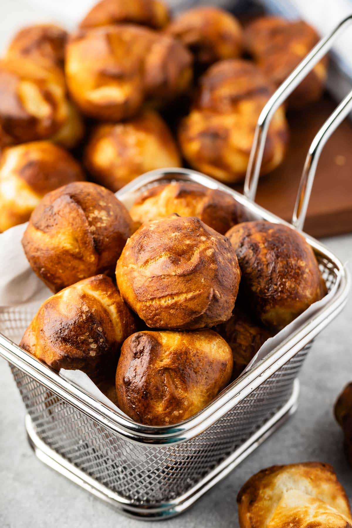 pretzel bites in a metal sifter