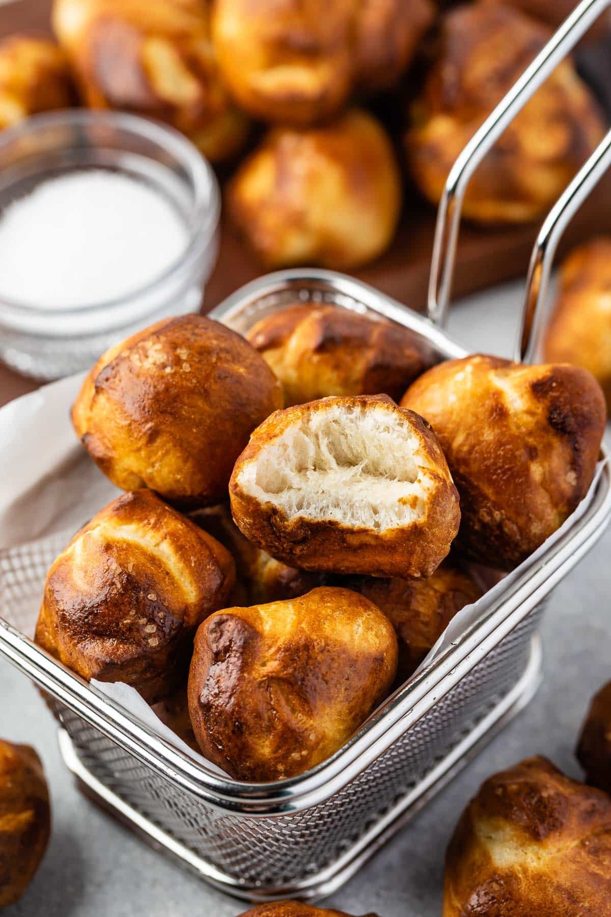 pretzel bites in a metal sifter