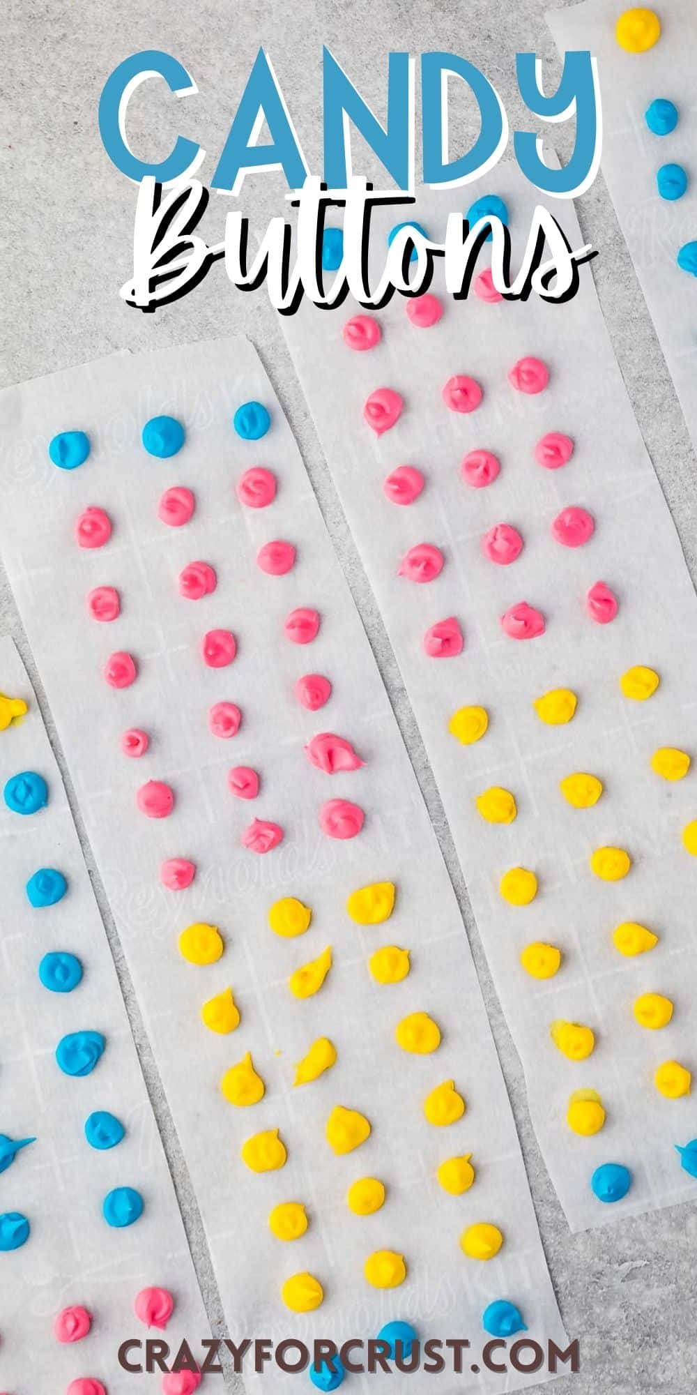 blue, pink and yellow buttons on parchment paper with words on the image