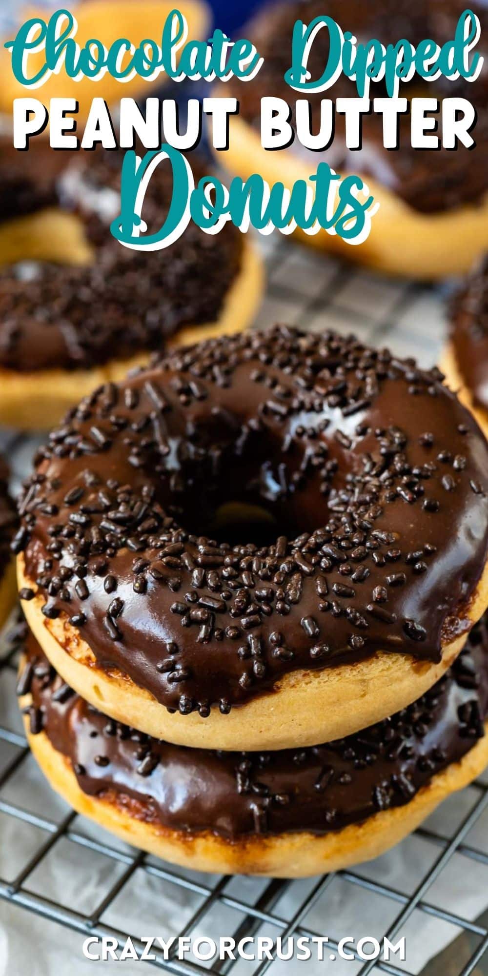 stacked peanut butter donut dipped in chocolate with chocolate sprinkles on top with words on the image