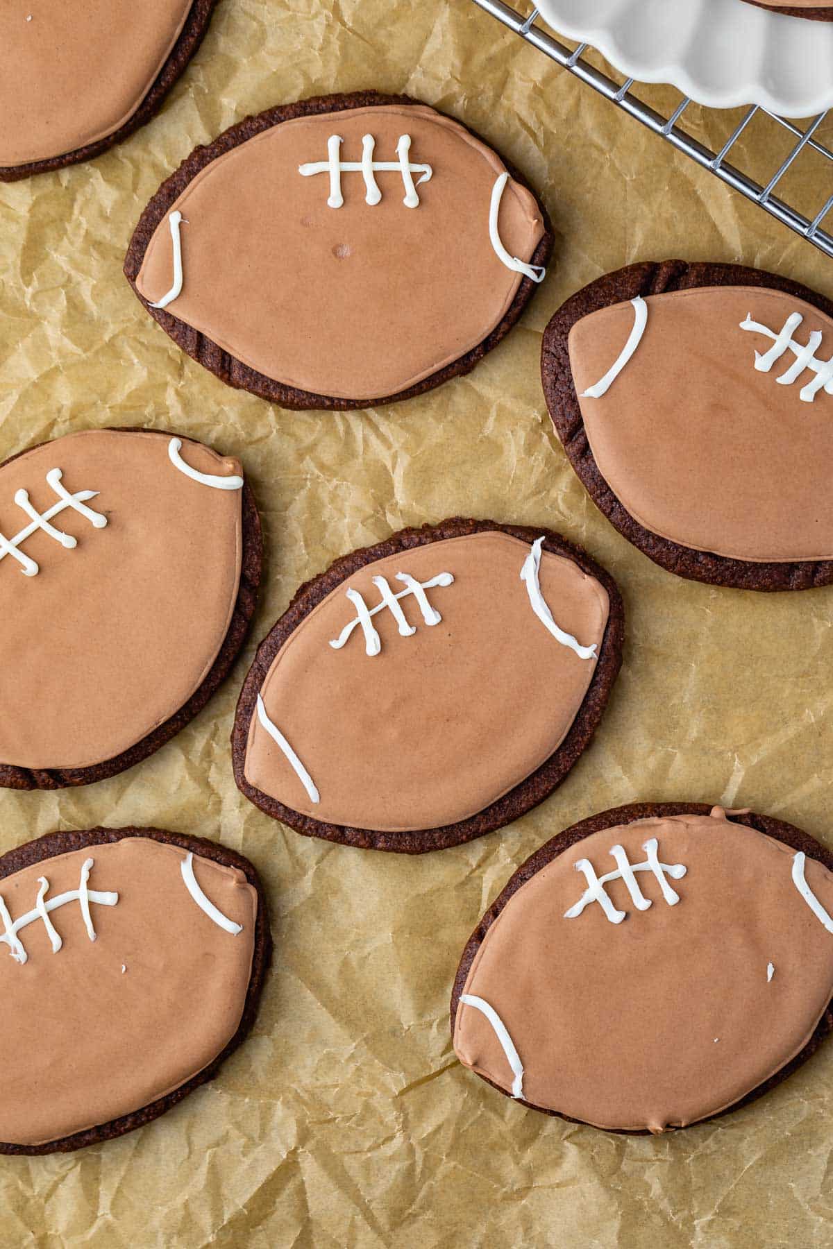 football shaped cookies with football themed chocolate icing