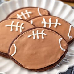 football shaped cookies with football themed chocolate icing