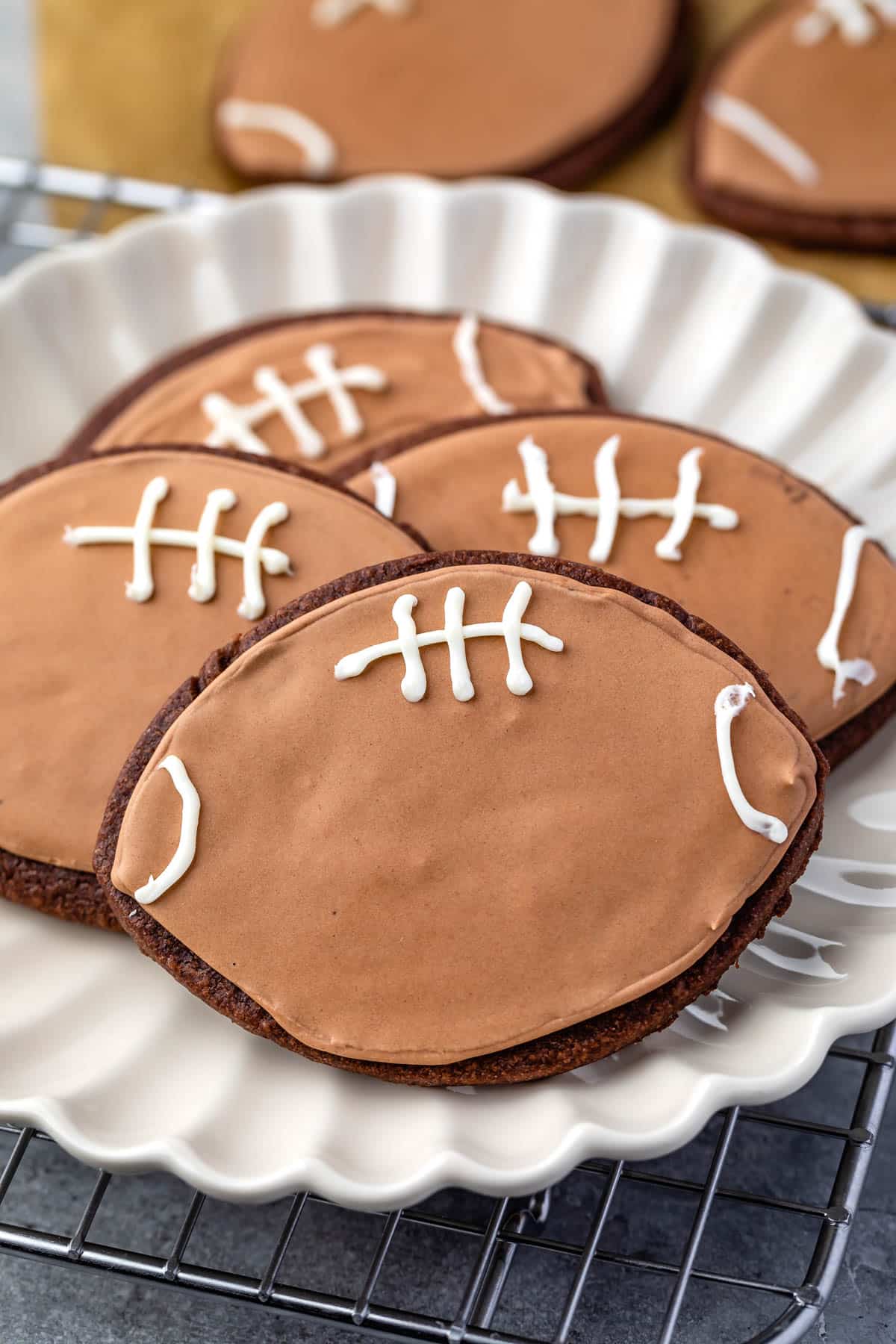 football shaped cookies with football themed chocolate icing