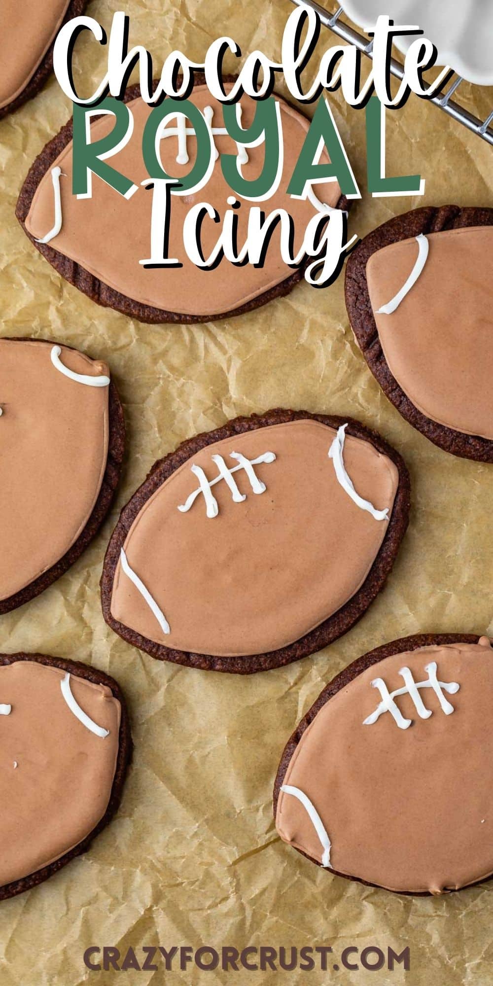 football shaped cookies with football themed chocolate icing with words on the image