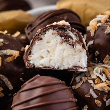 truffles covered in chocolate in a white bowl.