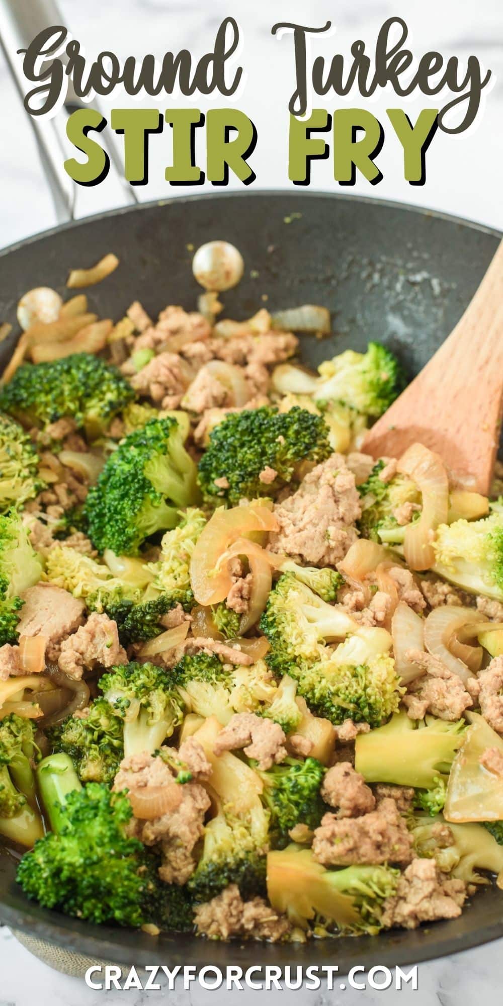 broccoli and meat mixed together in a black pan with words on the image