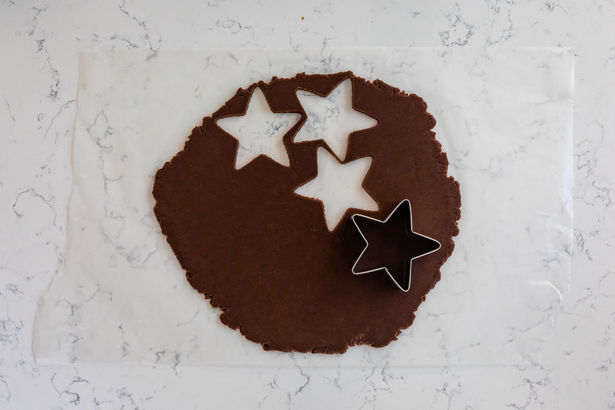 rolled out cookie dough with star cutouts