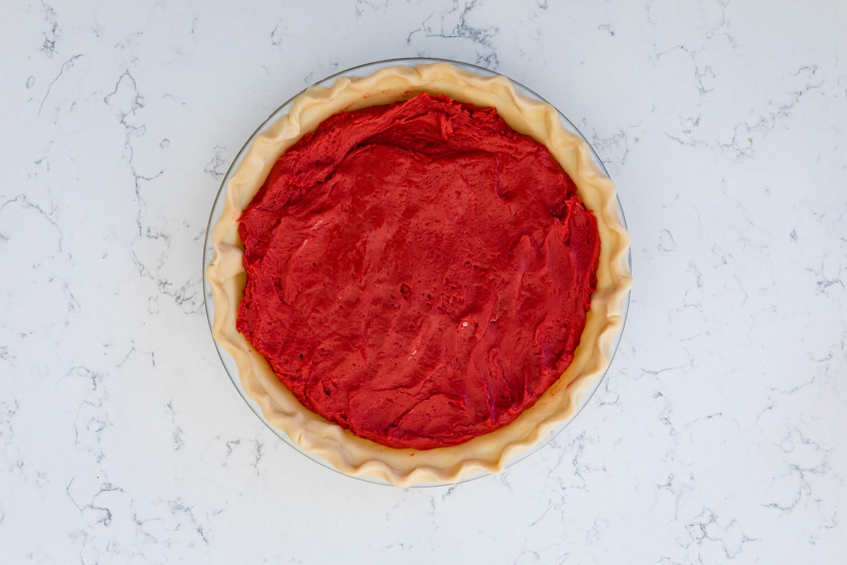 red velvet pie in a glass pie plate unbaked